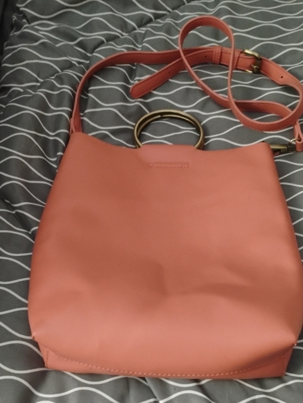 Anthropologie Strap Bucket Bag in Light Oramge with 2 Gold Ring Handles.